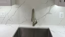 Calacatta Super Bella Super Jumbo (Bookmatched) - lyheggmdzushdjwqrqfc@2x.jpg
